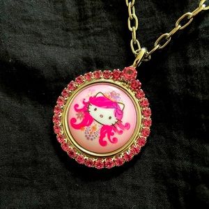 Hello Kitty pink head necklace by Tarina Tarantino